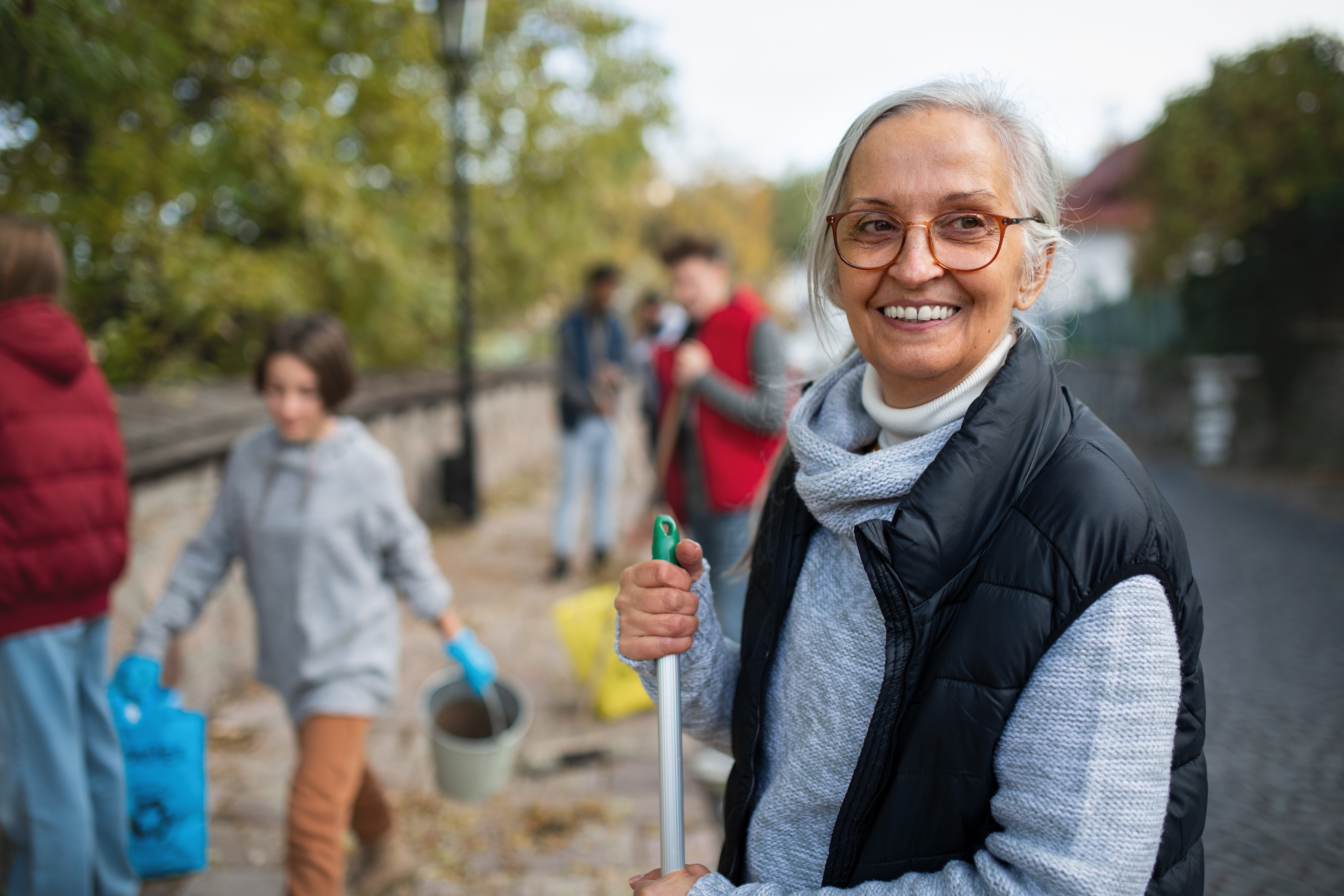 Woman smiling while cleaning with a brush